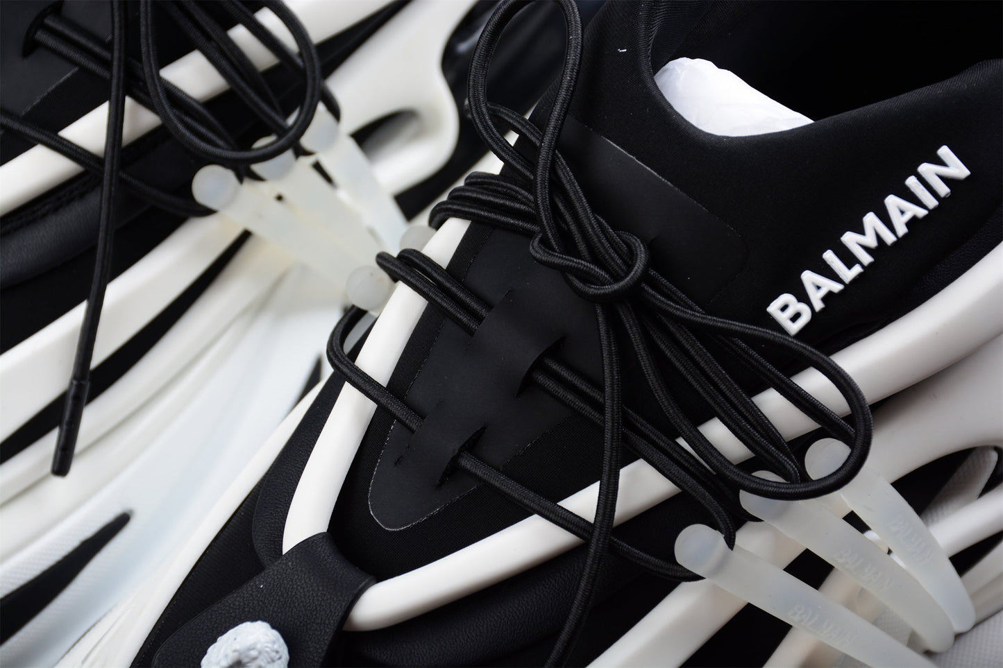 Balmain Unicorn Low-Top Sneakers in White/Black – Neoprene and Leather