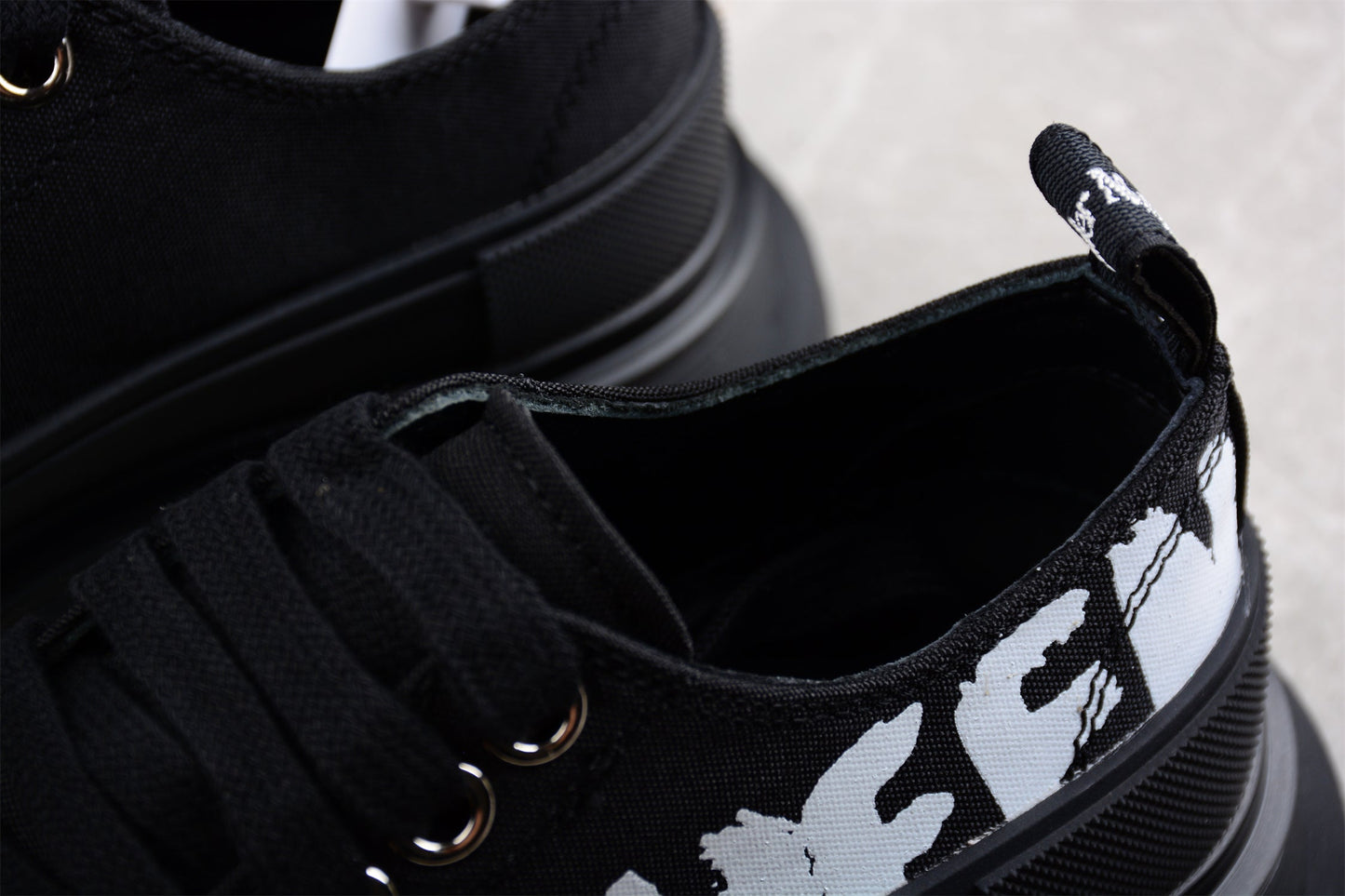 Alexander McQueen Tread Slick Low Lace-Up in Canvas Graffiti Black
