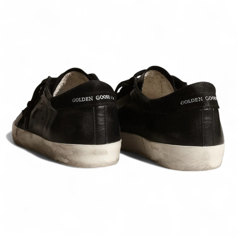 Super-Star in black nappa with black suede star and heel tab